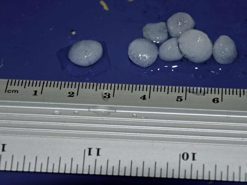 medium size hail with ruler